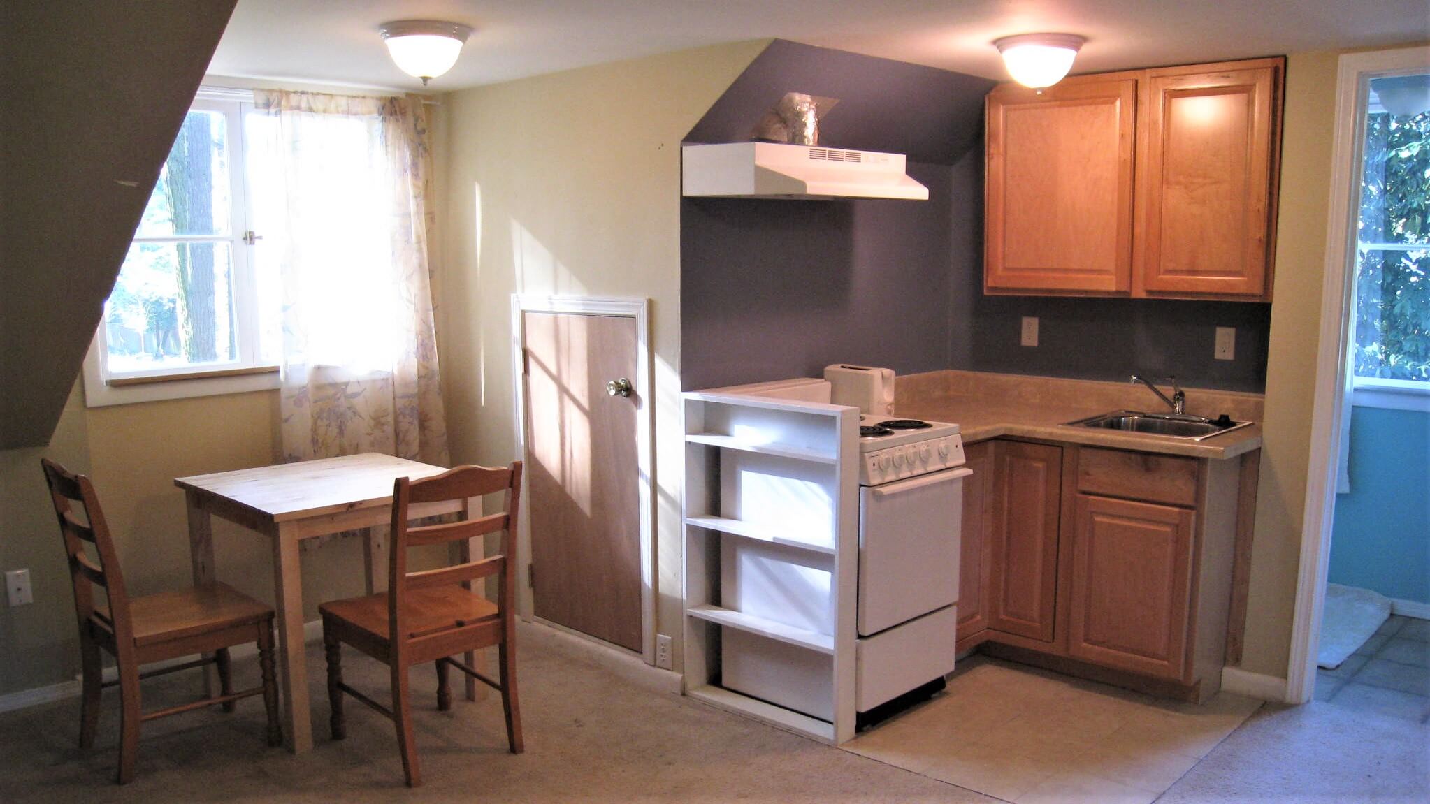 Attic renovation: transformed space with new insulation and drywall